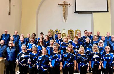 photo of the mercian singers wearing blue