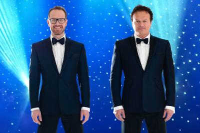 The Tenors wearing black tuxedo's smiling into the camera