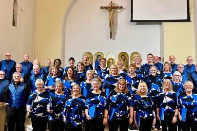 photo of the mercian singers wearing blue