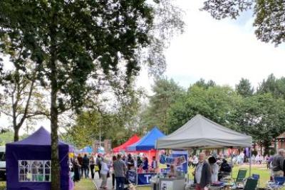 Tamworth Castle grounds with stalls and marquees on a sunny day